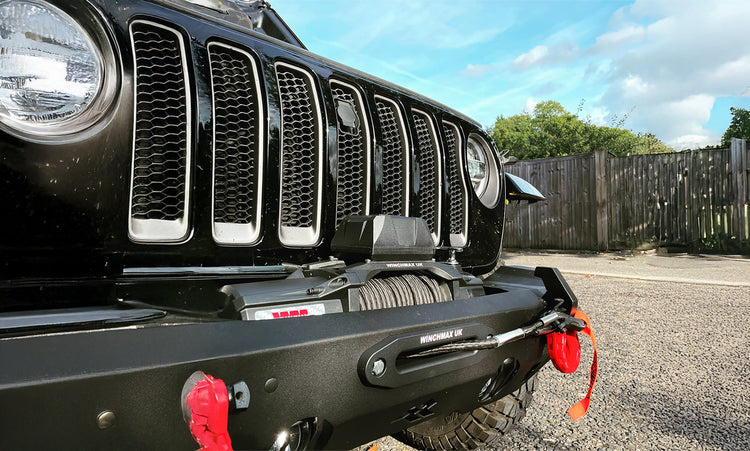 Winchmax Military Grade winch mounted to front of Jeep.
